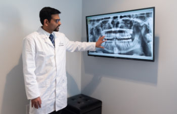 Dr. Aakar Chokshi with x-ray panoramic photo.