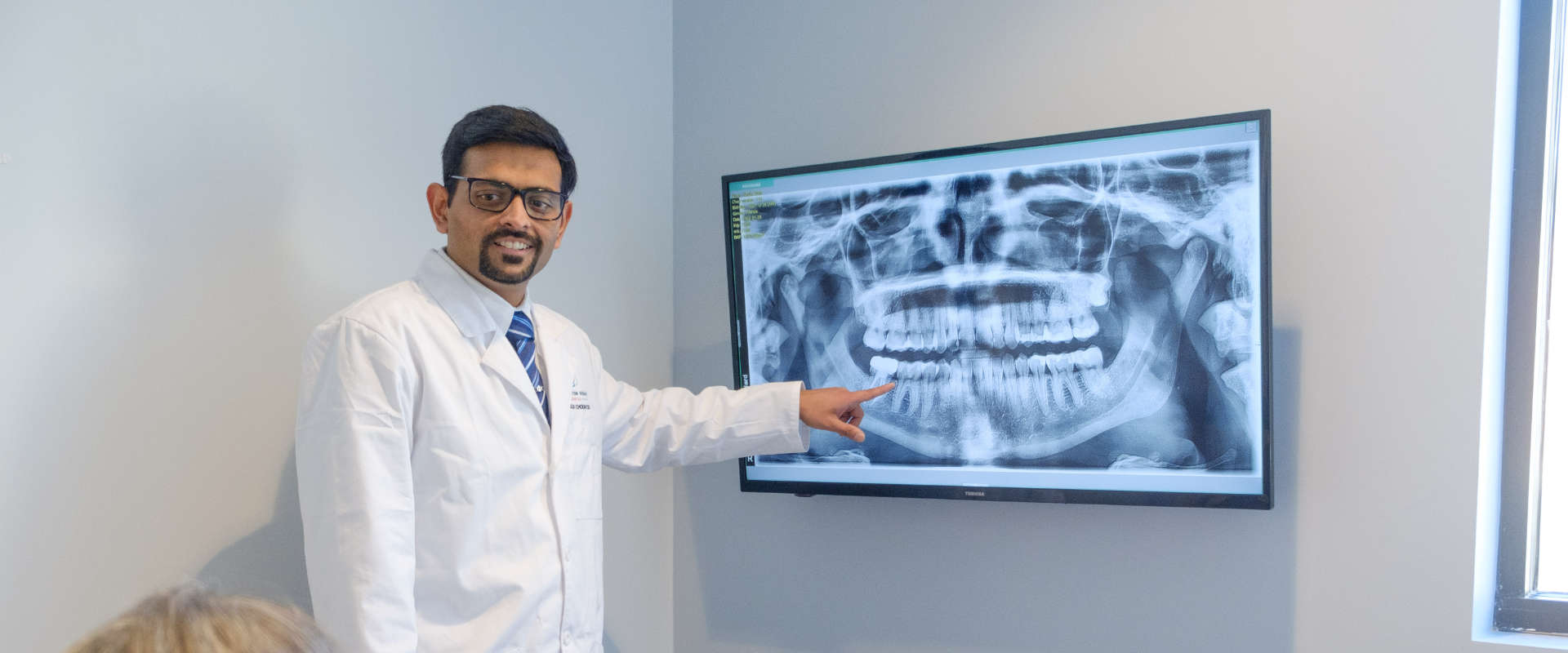 Dr Chokshi with xray panoramic photo.