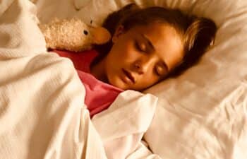 child sleeping soundly after visiting dentist near me for kids for a nightguard